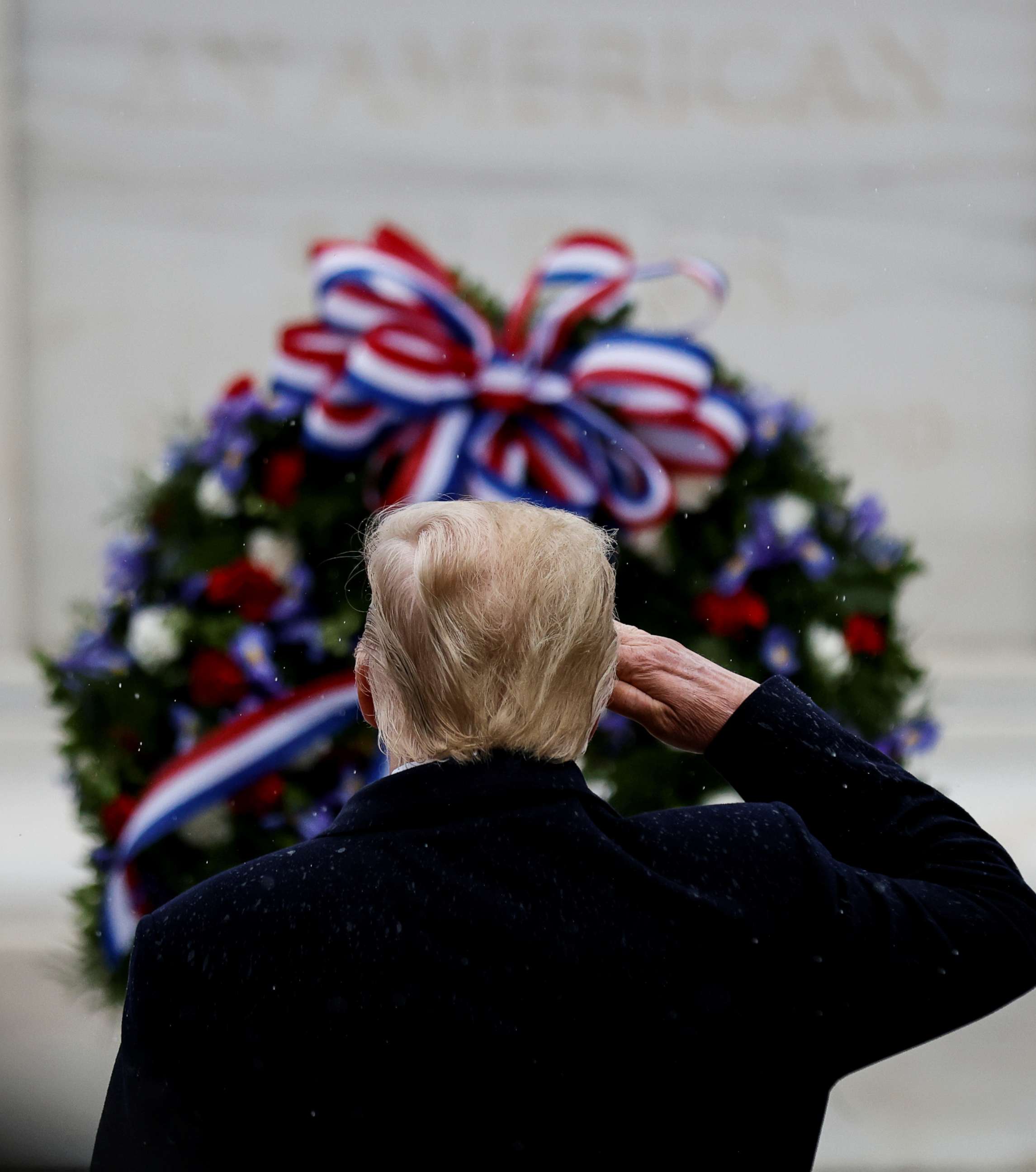 PHOTO: President Donald Trump salutes at the Tomb of the Unknown Solider as he attends a Veterans Day observance in Arlington National Cemetery in Arlington, Va., Nov. 11, 2020.