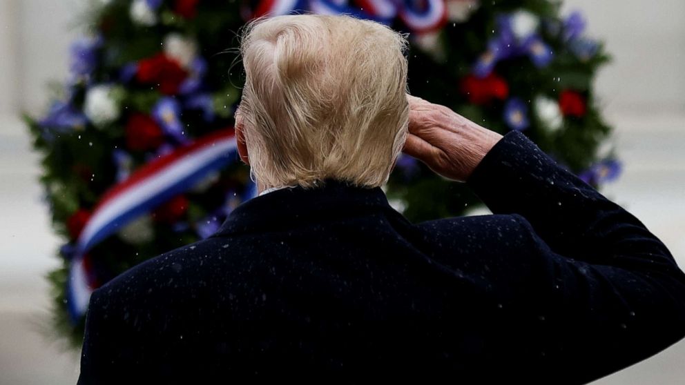 PHOTO: President Donald Trump salutes at the Tomb of the Unknown Solider as he attends a Veterans Day observance in Arlington National Cemetery in Arlington, Va., Nov. 11, 2020.