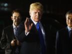 President Donald Trump arrives at Paya Lebar Air Base for a summit with North Korean leader Kim Jong Un, Sunday, June 10, 2018, in Singapore.