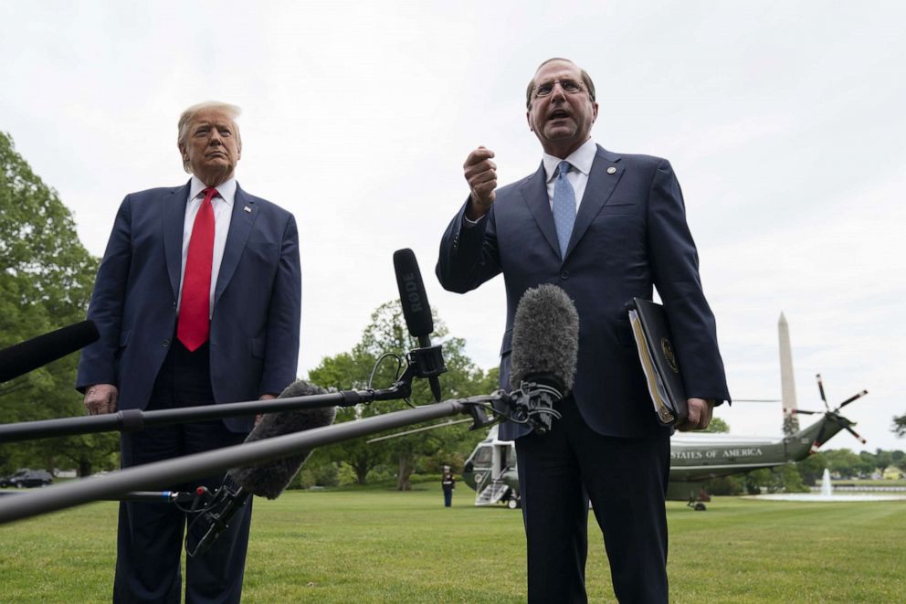 PHOTO: President Donald Trump and Health and Human Services Secretary Alex Azar speak to reporters on his way to Marine One on the South Lawn of the White House on May 14, 2020, in Washington.