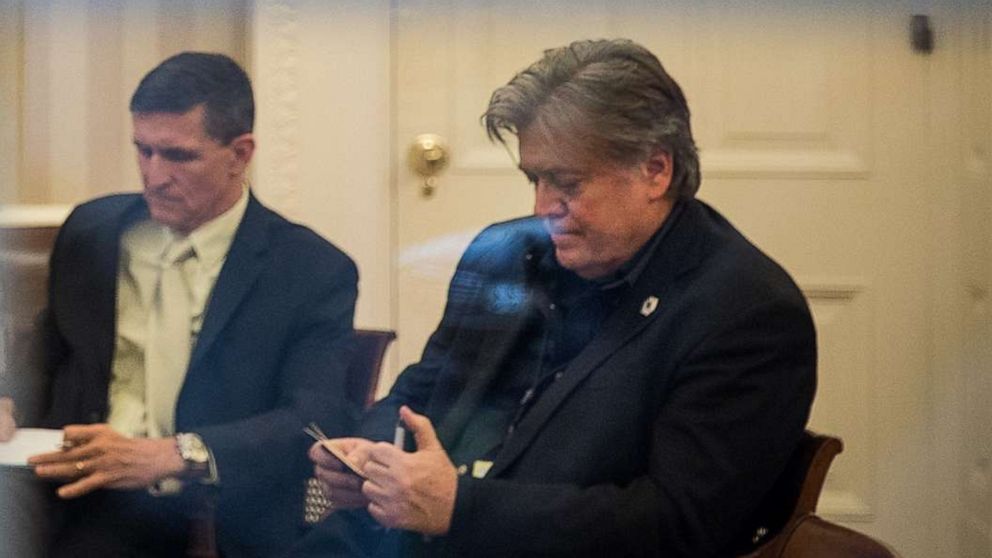 PHOTO: In this Jan. 28, 2017, file photo, President Donald Trump speaks on the phone in the Oval Office of the White House in Washington, D.C., as National Security Advisor Michael Flynn and White House Chief Strategist Steve Bannon look on.