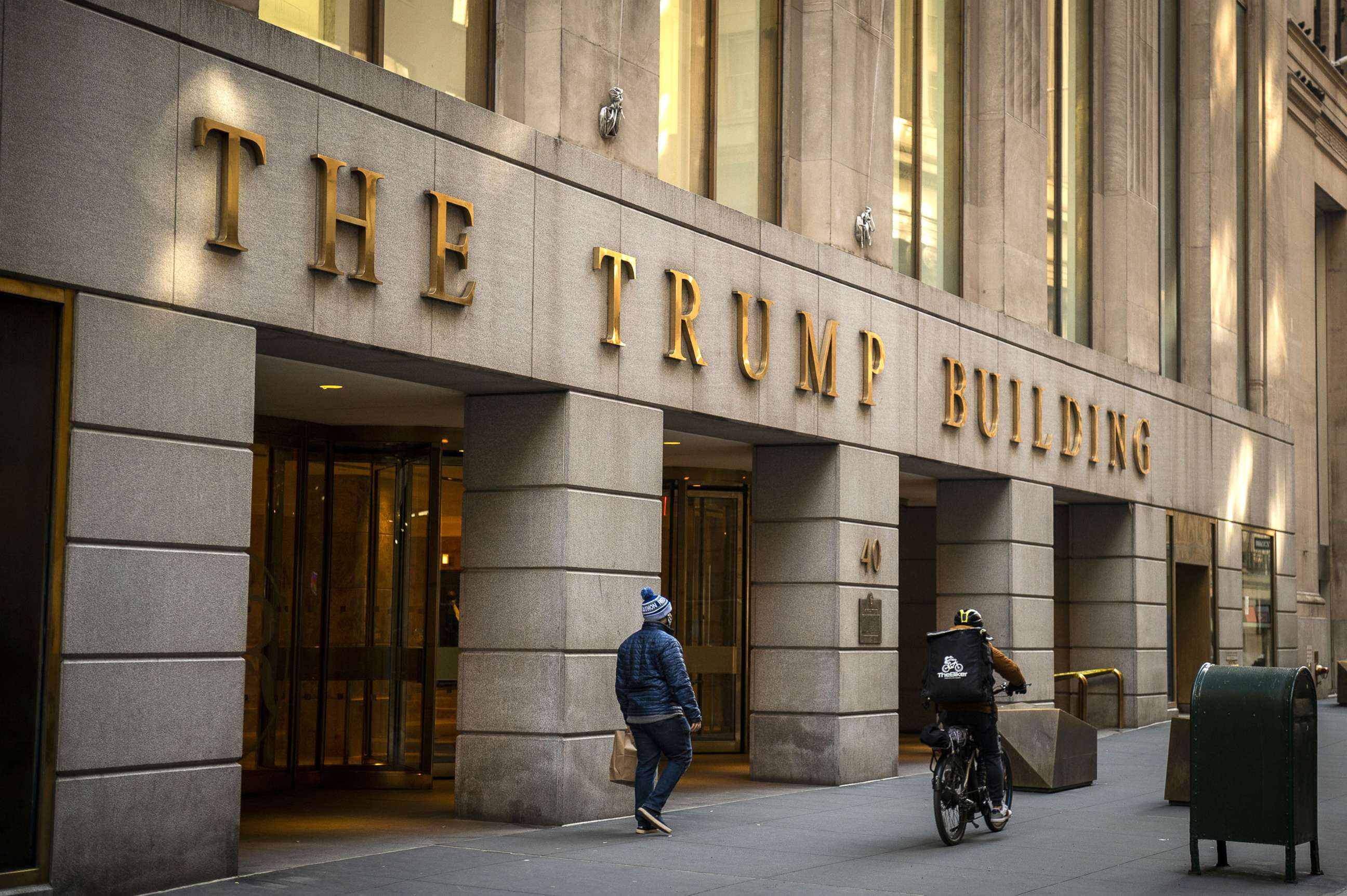 PHOTO: In this Jan. 24, 2021, file photo, a pedestrian walks past the Trump Building in New York.