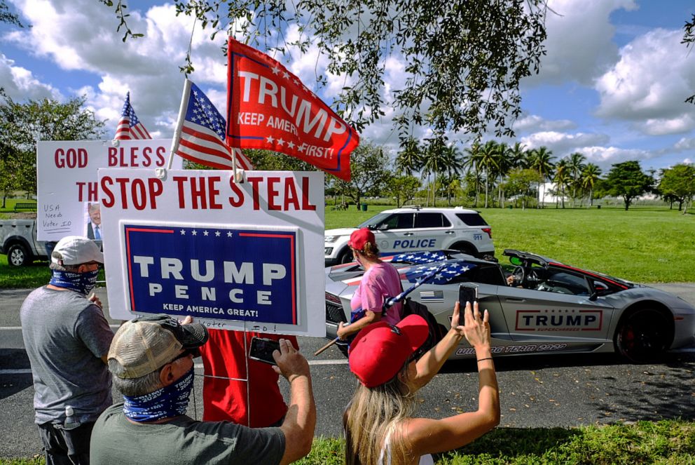 PHOTO: In this Nov. 29, 2020, file photo, people take photos of the bus dedicated for March for Trump bus tour, a two week multi-state rally in support of President Donald Trump, in Doral, Fla.