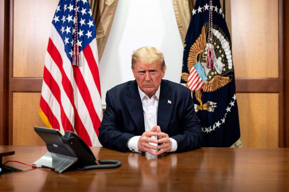 PHOTO: This handout photo released by the White House shows US President Donald Trump and his Chief of Staff (not pictured) participating in a phone call on October 4, 2020, in his conference room at Walter Reed National Military Medical Center. 