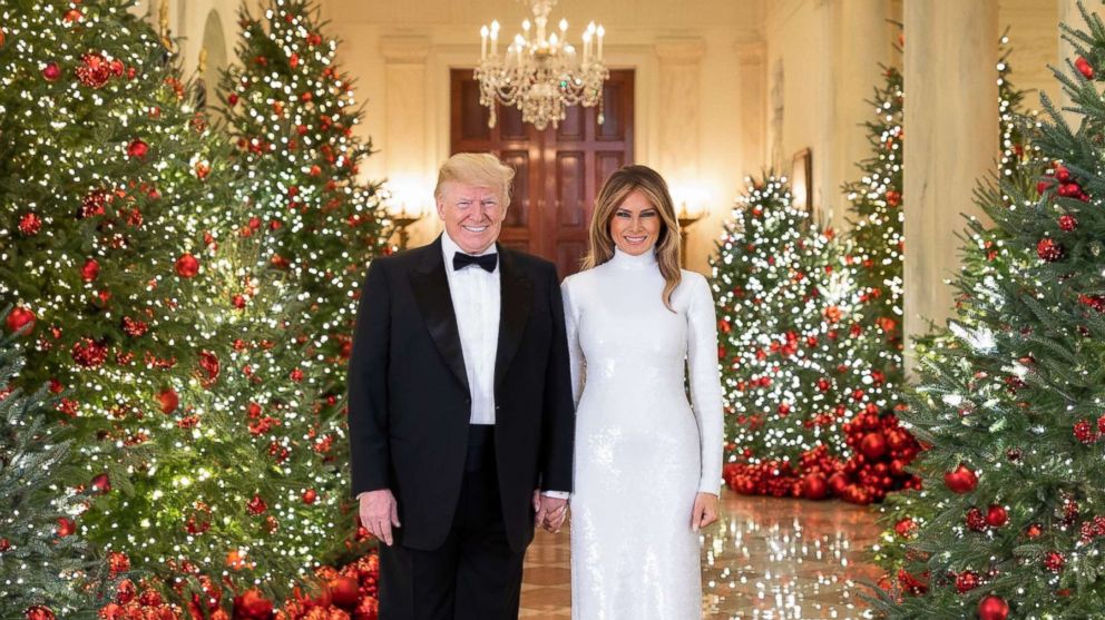 President Donald J. Trump and First Lady Melania Trump are seen in their official Christmas portrait in the Cross Hall of the White House.