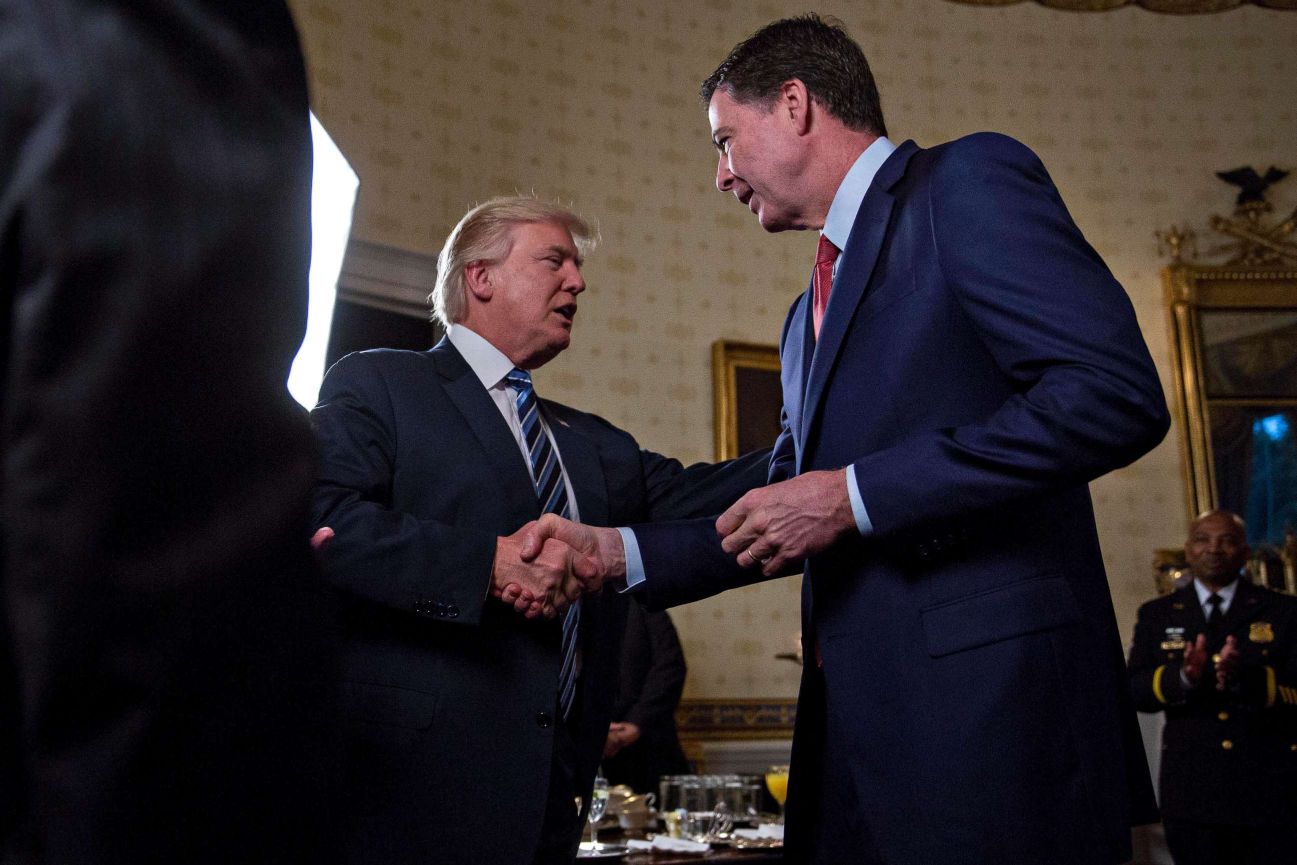 PHOTO: Donald Trump shakes hands with James Comey, during an Inaugural Law Enforcement Officers and First Responders Reception, Jan. 22, 2017, in Washington.