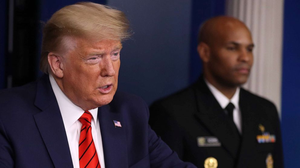 PHOTO: President Donald Trump speaks speaks on the latest developments of the coronavirus outbreak, while flanked by U.S. Surgeon General Jerome Adams, in the James Brady Press Briefing Room at the White House, March 19, 2020 in Washington.