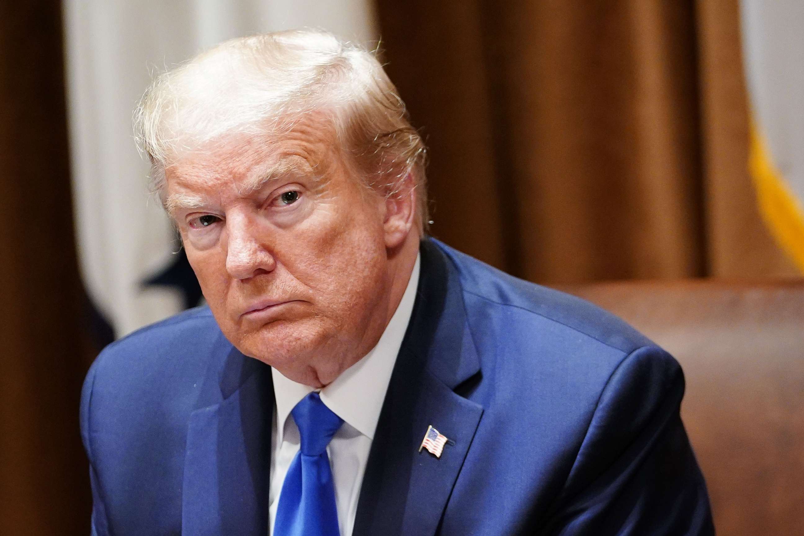 PHOTO: US President Donald Trump looks on during a meeting with military leaders and his national security team in the Cabinet Room of the White House in Washington, DC on May 9, 2020. 