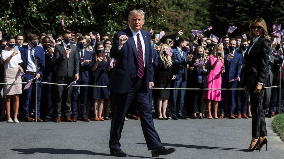 PHOTO: President Donald Trump gestures to reporters as he departs with first lady Melania Trump to participate in his first presidential debate with Democratic presidential nominee Joe Biden in Cleveland, from Washington, Sept. 29, 2020.