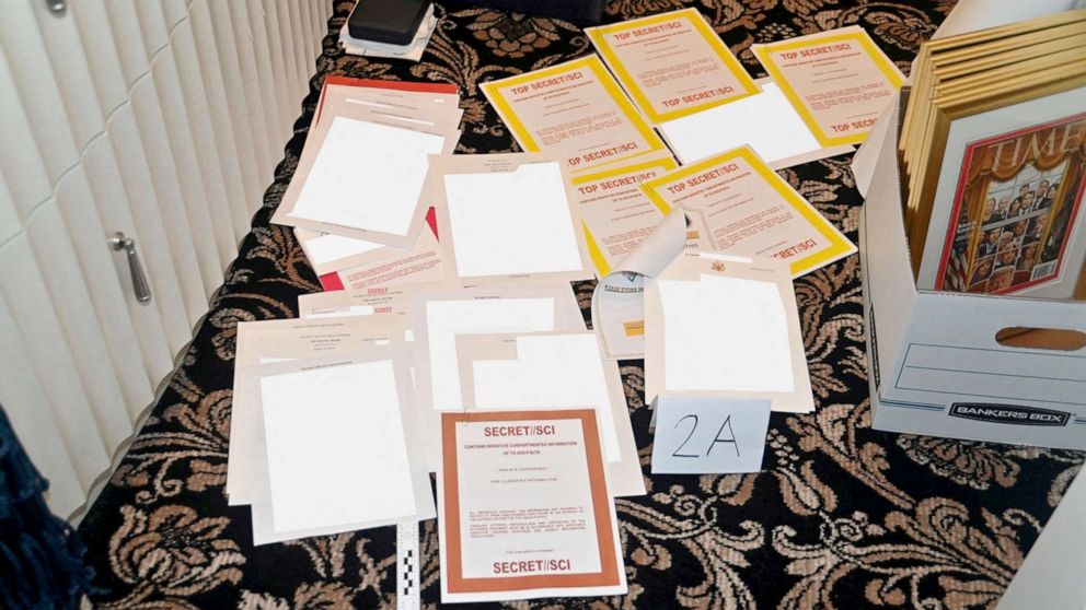 Photo: FBI photo of redacted documents and classified cover sheets recovered from a container kept at former President Donald Trump's Florida mansion, filed with the U.S. Department of Justice on August 30, 2022. 