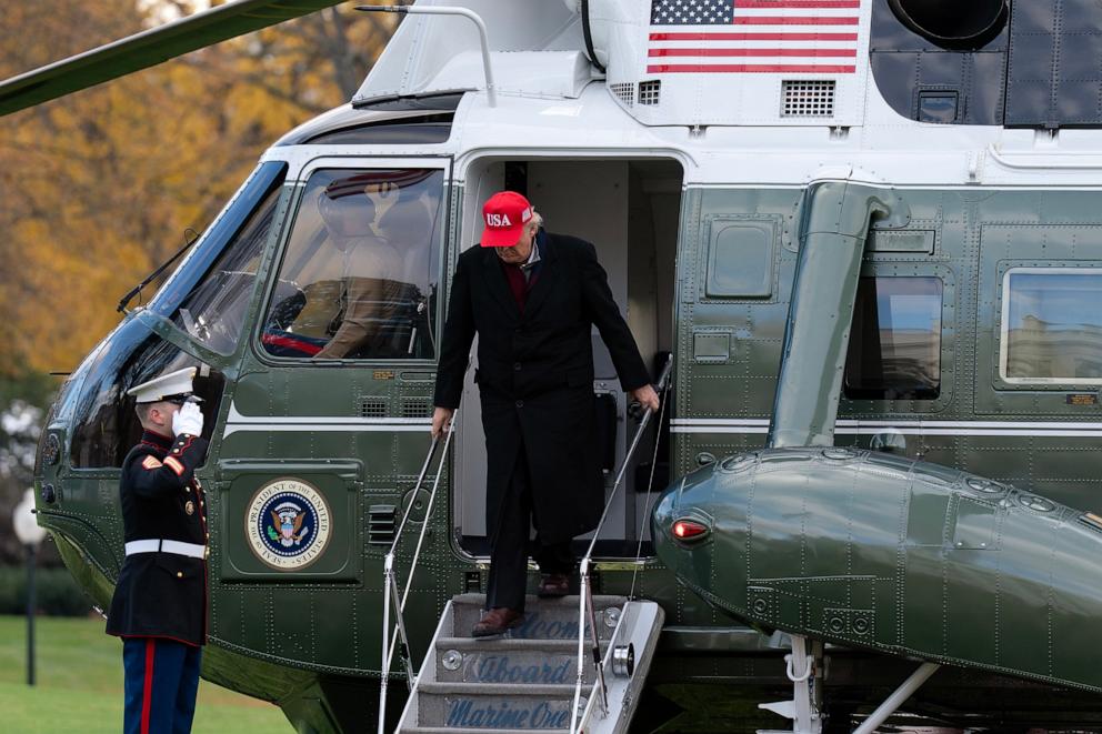 PHOTO: President Donald Trump steps off Marine One upon his arrival to the White House, Saturday, Nov. 22, 2025, in Washington.