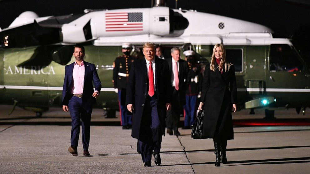 PHOTO: Donald Trump Jr., President Donald Trump and daughter Senior Advisor Ivanka Trump make their way to board Air Force One before departing from Dobbins Air Reserve Base in Marietta, Ga, Jan. 4, 2021.