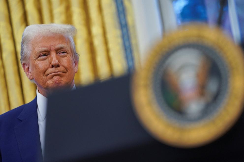 PHOTO: U.S. President Donald Trump looks on, during Tulsi Gabbard's swearing in ceremony as Director of National Intelligence, in the Oval Office at the White House in Washington, D.C., Feb. 12, 2025.