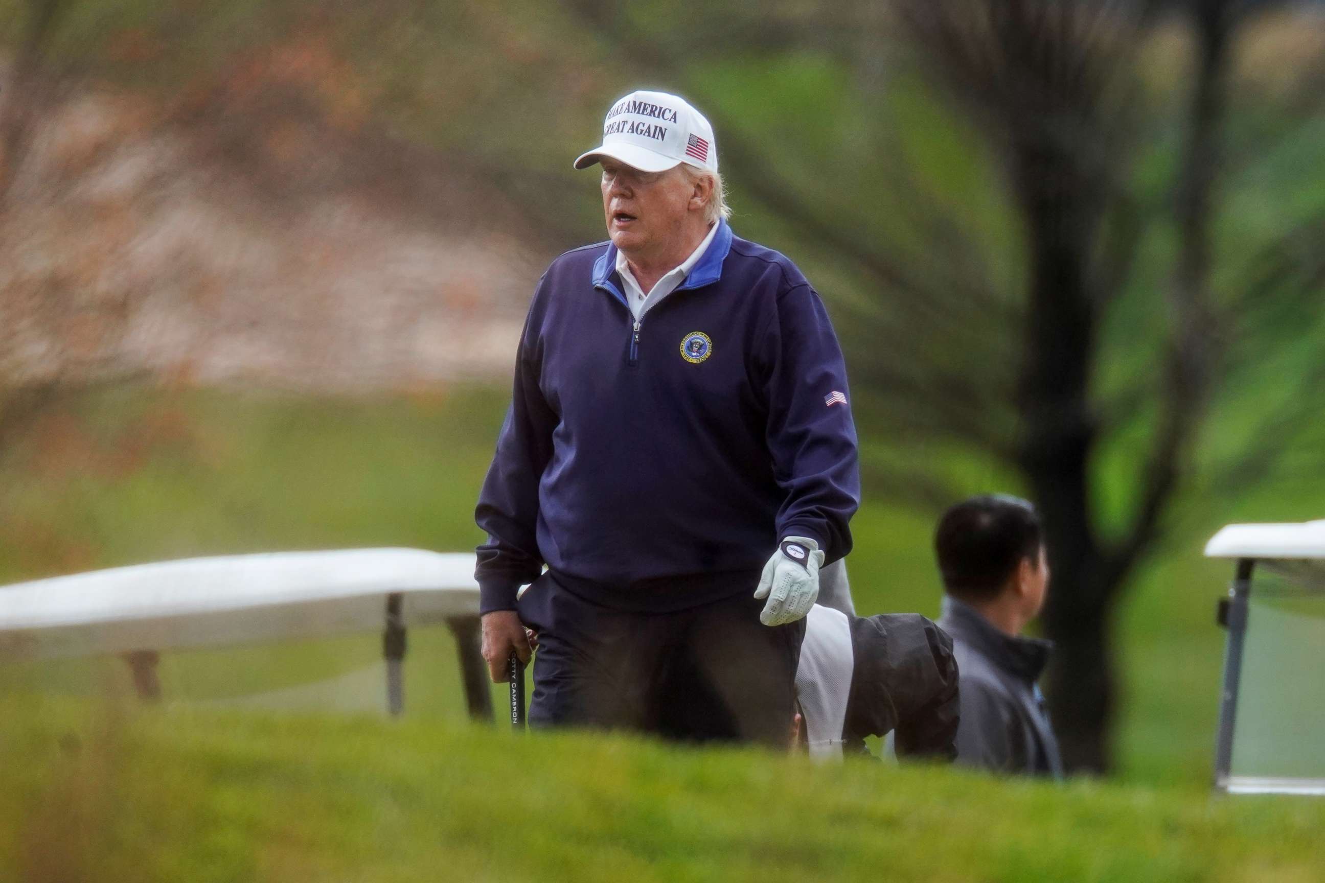 PHOTO: U.S. President Donald Trump plays golf at the Trump National Golf Club in Sterling, Virginia, U.S., November 15, 2020.