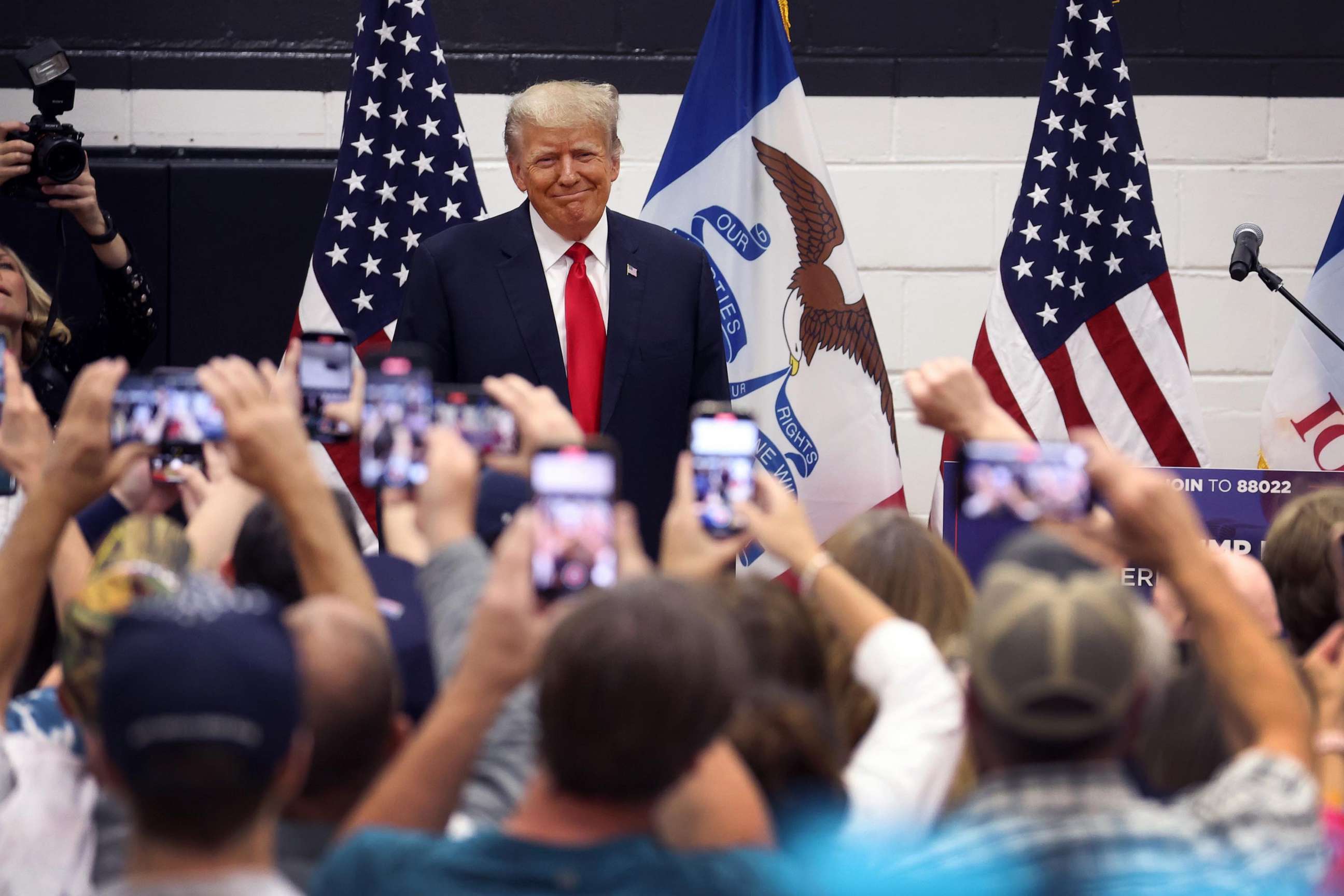 PHOTO: Former President Donald Trump greets supporters at a Team Trump volunteer leadership training event held at the Grimes Community Complex, on June 1, 2023, in Grimes, Iowa.