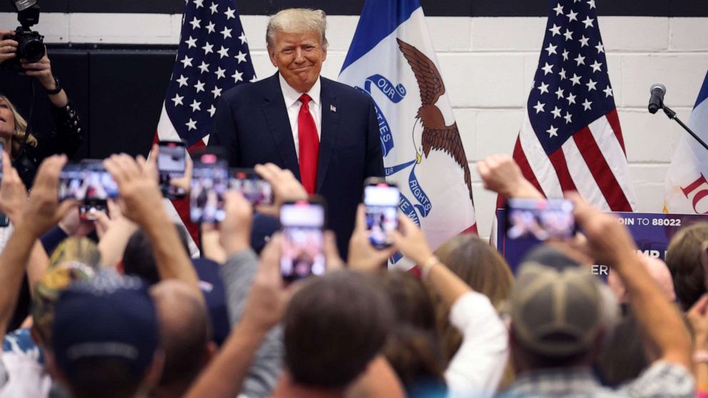 PHOTO: Former President Donald Trump greets supporters at a Team Trump volunteer leadership training event held at the Grimes Community Complex, on June 1, 2023, in Grimes, Iowa.