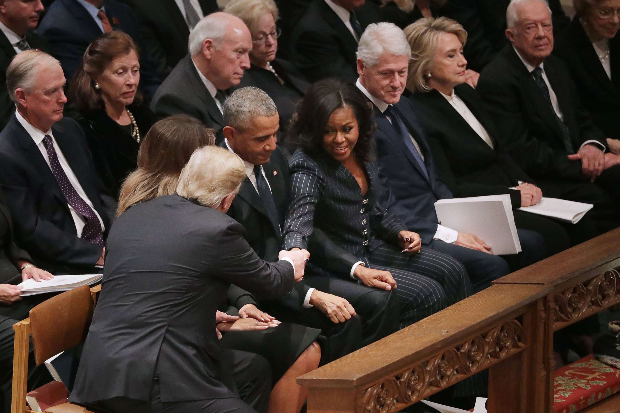 PHOTO: President Donald Trump and first lady Melania Trump greet former President Barack Obama and Michelle Obama, joining other former presidents and their spouses for the state funeral for former President George H.W. Bush, Dec. 5, 2018 in Washington.