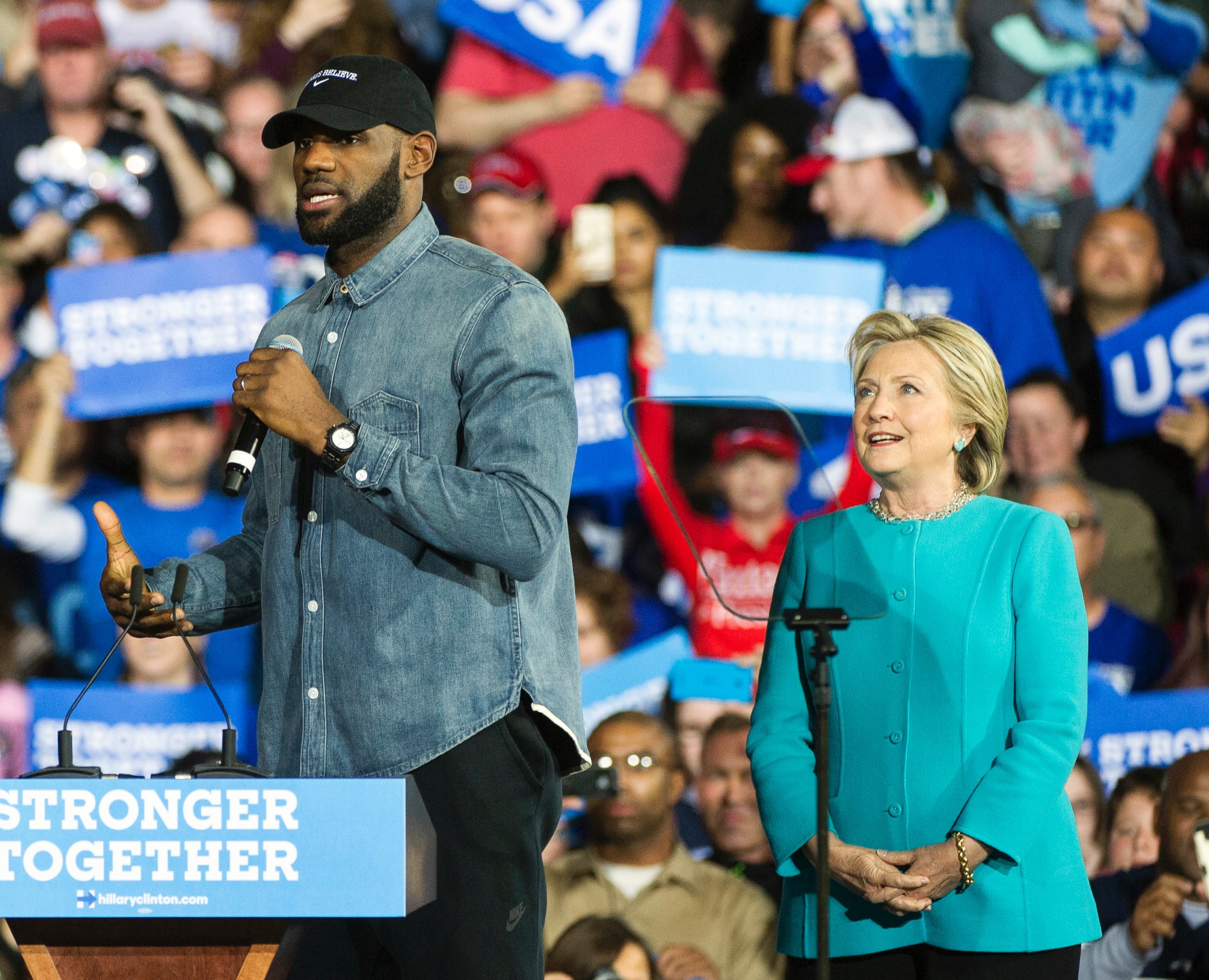 Cleveland Cavaliers star LeBron James speaks as Democratic presidential candidate Hillary Clinton listens during a campaign stop at Cleveland Public Hall in Cleveland, Sunday, Nov. 6, 2016.