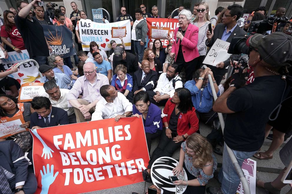 PHOTO: Eleanor Smeal, president of the Feminist Majority, speaks as protesters block the entrance of the headquarters of U.S. Customs and Border Protection during a protest, June 13, 2018, in Washington, DC.