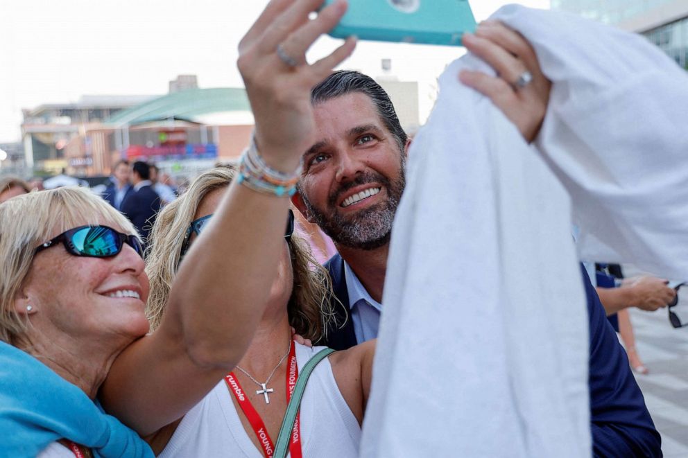 PHOTO: Donald Trump Jr. mingles with attendees as he arrives at the debate hall to watch the Republican U.S. presidential candidates in their first primary debate of the 2024 campaign in Milwaukee, Aug. 23, 2023.