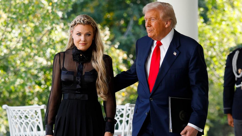 PHOTO: Erika Kirk wife of late conservative activist Charlie Kirk, arrives with President Donald Trump as he posthumously awards the Presidential Medal of Freedom to Charlie Kirk in the Rose Garden of the White House, OCt. 14, 2025 in Washington.