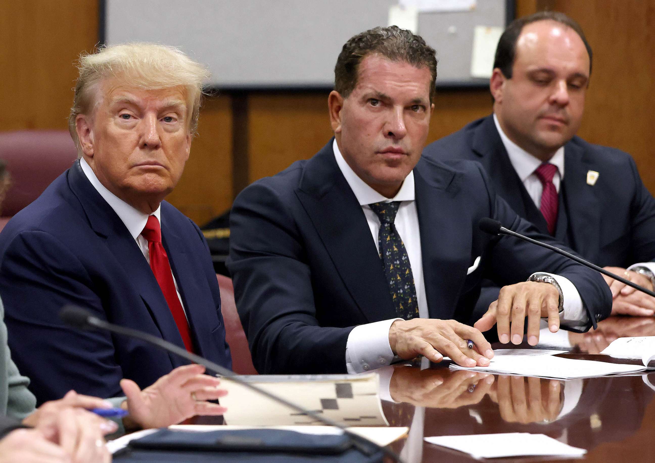 PHOTO: FILE - Former U.S. President Donald Trump sits with his attorneys Joe Tacopina and Boris Epshteyn inside the courtroom during his arraignment at the Manhattan Criminal Court April 4, 2023 in New York City.