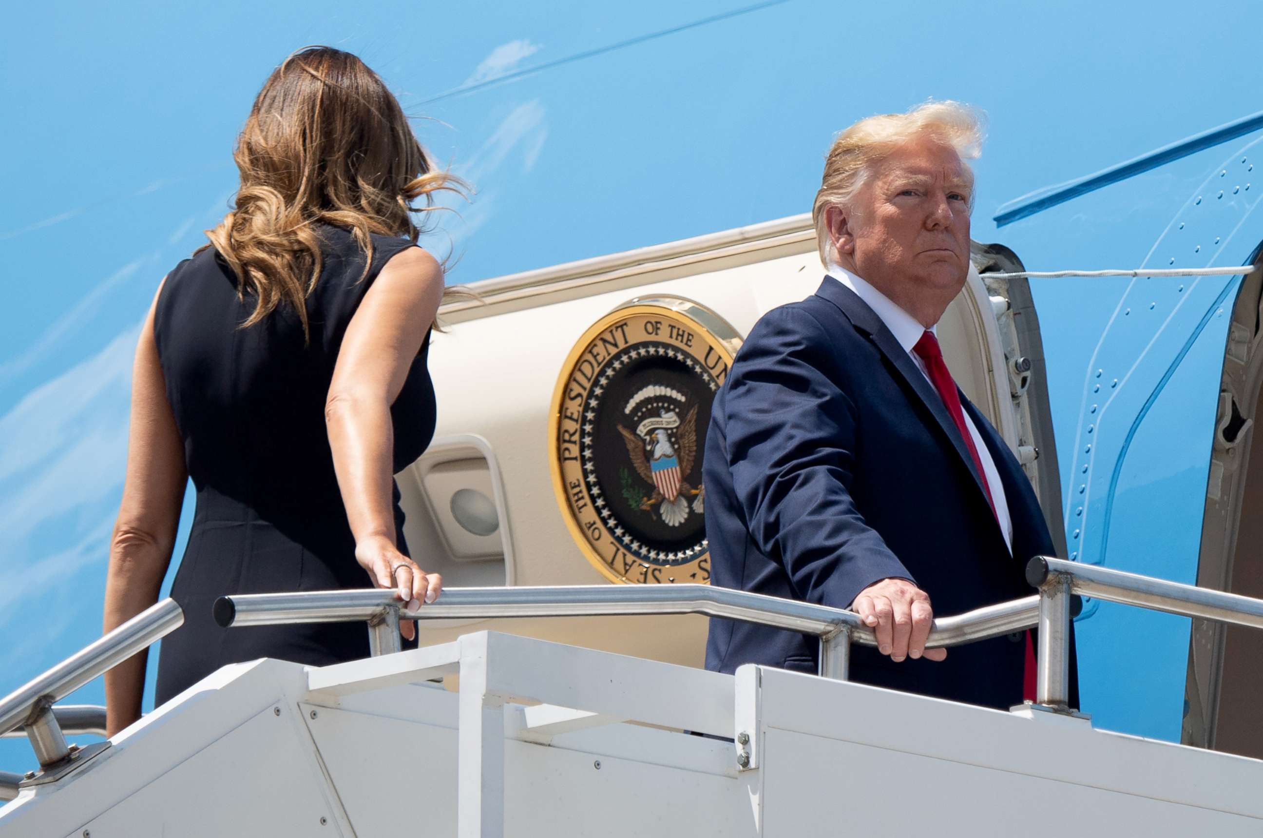 PHOTO: President Donald Trump, with first lady Melania Trump, boards Air Force One at Wright-Patterson Air Force Base in Ohio, Aug. 7, 2019.