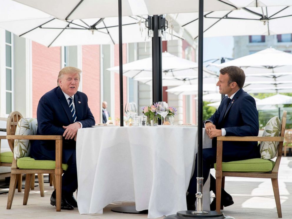 PHOTO: U.S President Donald Trump sits for lunch with French President Emmanuel Macron, right, at the Hotel du Palais in Biarritz, south-west France, Saturday Aug. 24, 2019.