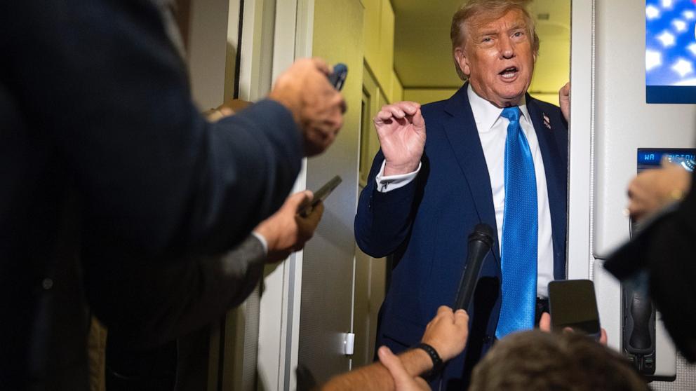 PHOTO: President Donald Trump speaks with reporters while flying aboard Air Force One en route from Calgary, Canada to Joint Base Andrews, Md., late Monday, June 16, 2025.