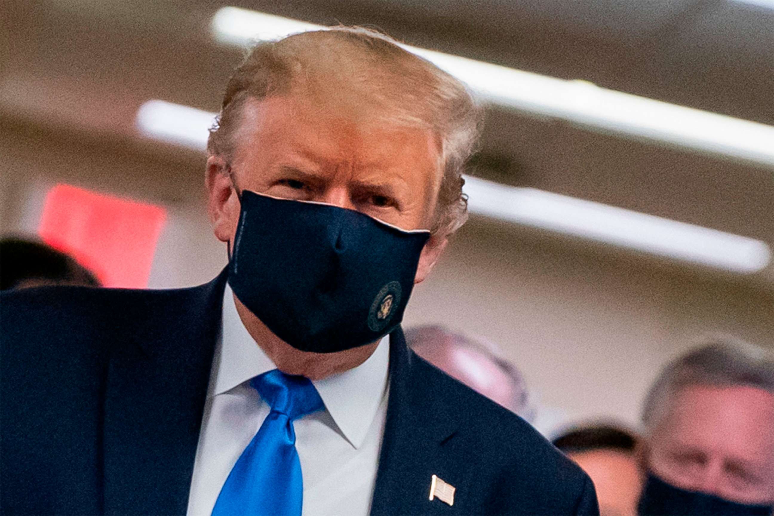 PHOTO: US President Donald Trump wears a mask as he visits Walter Reed National Military Medical Center in Bethesda, Maryland' on July 11, 2020.