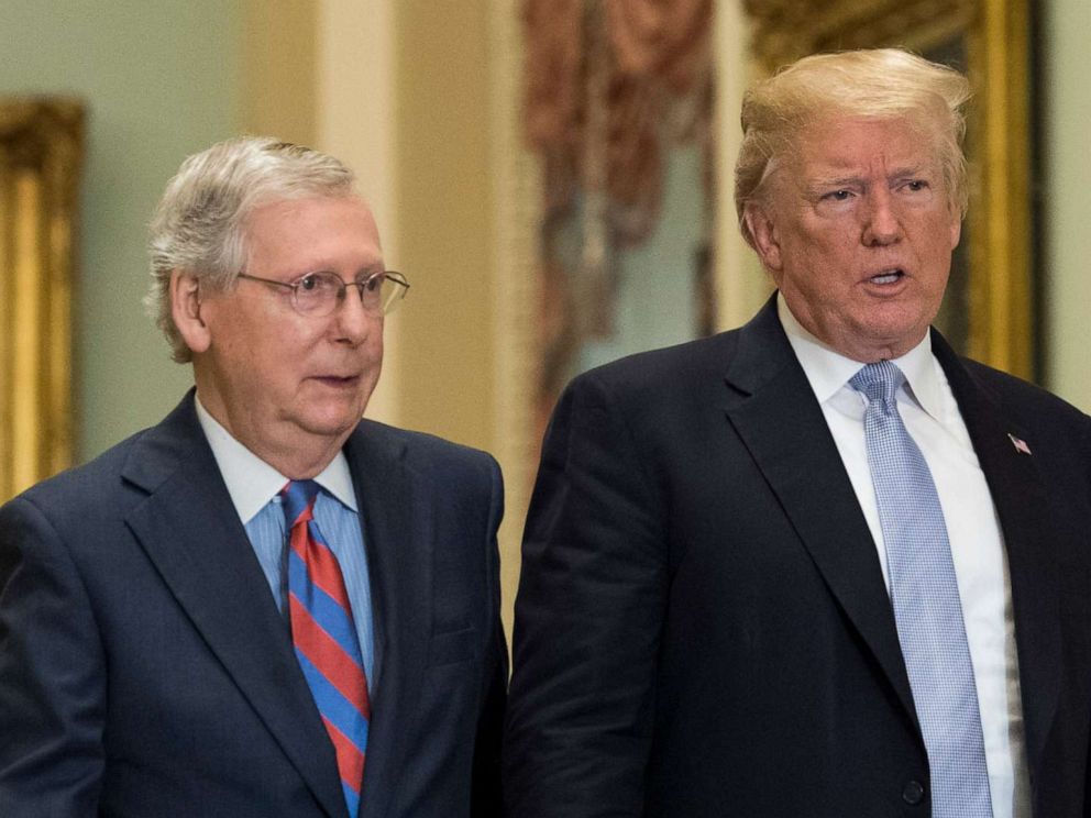 PHOTO: President Donald Trump walks with Senate Majority Leader Mitch McConnell at the Capitol on May 15, 2018, in Washington.