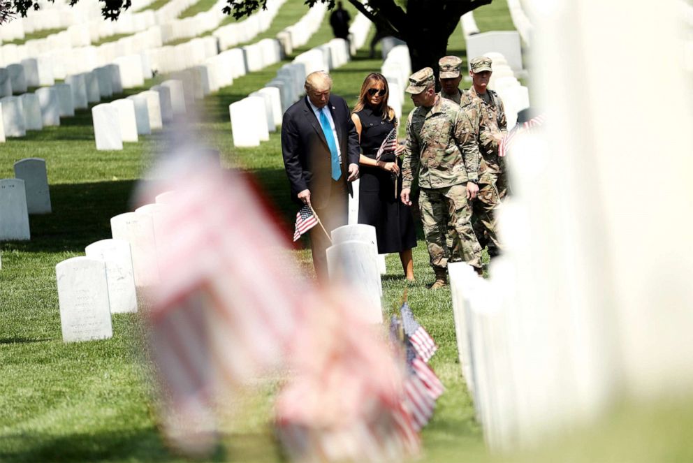 PHOTO: President Donald Trump and first lady Melania Trump visit Arlington National Cemetery for the annual Flags In ceremony ahead of Memorial Day Thursday, May 23, 2019, in Arlington, Va. 