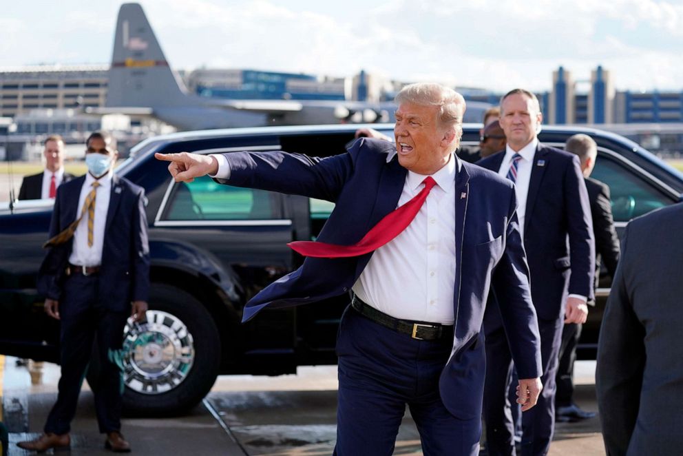 PHOTO: President Donald Trump gestures to supporters as he arrives at Minneapolis Saint Paul International Airport, Sept. 30, 2020, in Minneapolis.