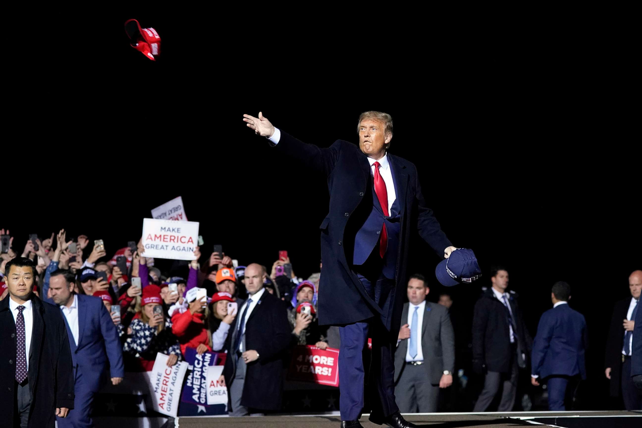 PHOTO: President Donald Trump throws hats to supporters after speaking at a campaign rally at Duluth International Airport in Duluth, Minn, Sept. 30, 2020.