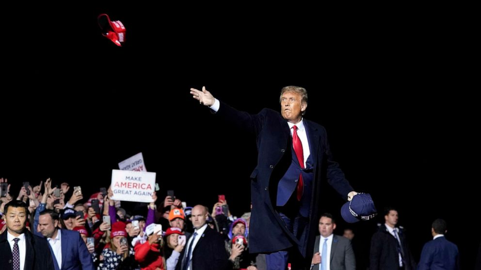 PHOTO: President Donald Trump throws hats to supporters after speaking at a campaign rally at Duluth International Airport in Duluth, Minn, Sept. 30, 2020.