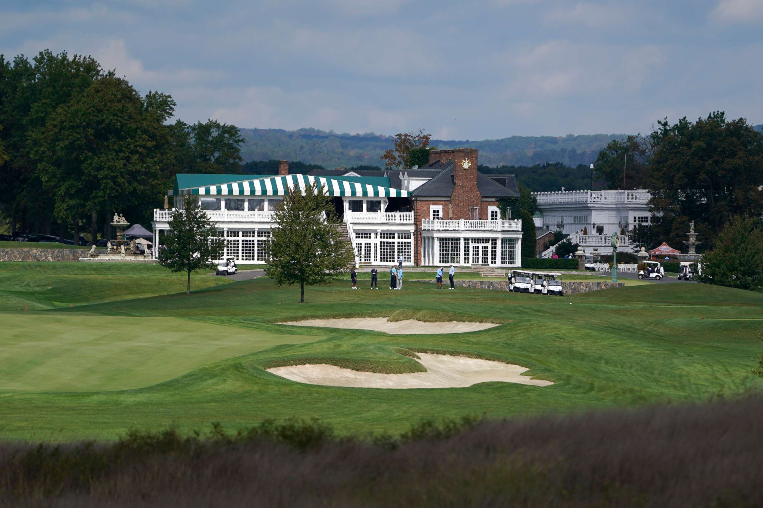 PHOTO: Golfers play golf at Trump National Golf Club in Bedminster, N.J., Friday, Oct. 2, 2020. With just a month to go until the election, President Donald Trump had a busy schedule in the week before the coronavirus hit home with him.