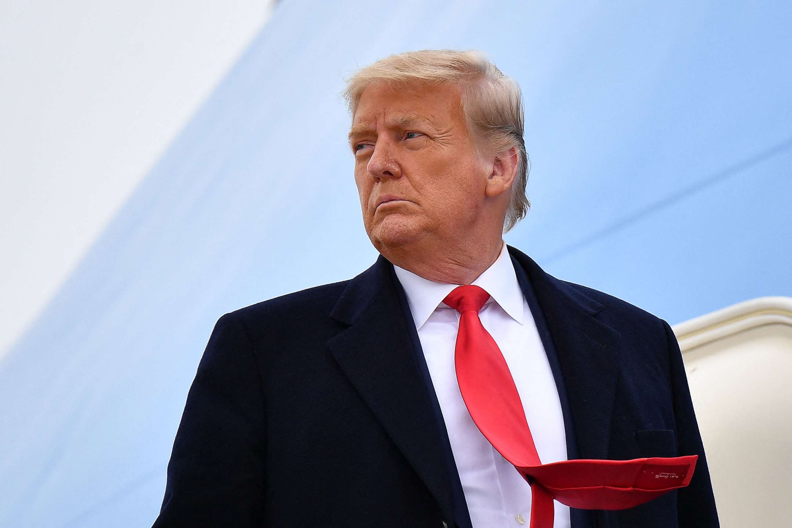 PHOTO: (FILES) In this file photo taken on January 12, 2021 US President Donald Trump boards Air Force One before departing Harlingen, Texas.