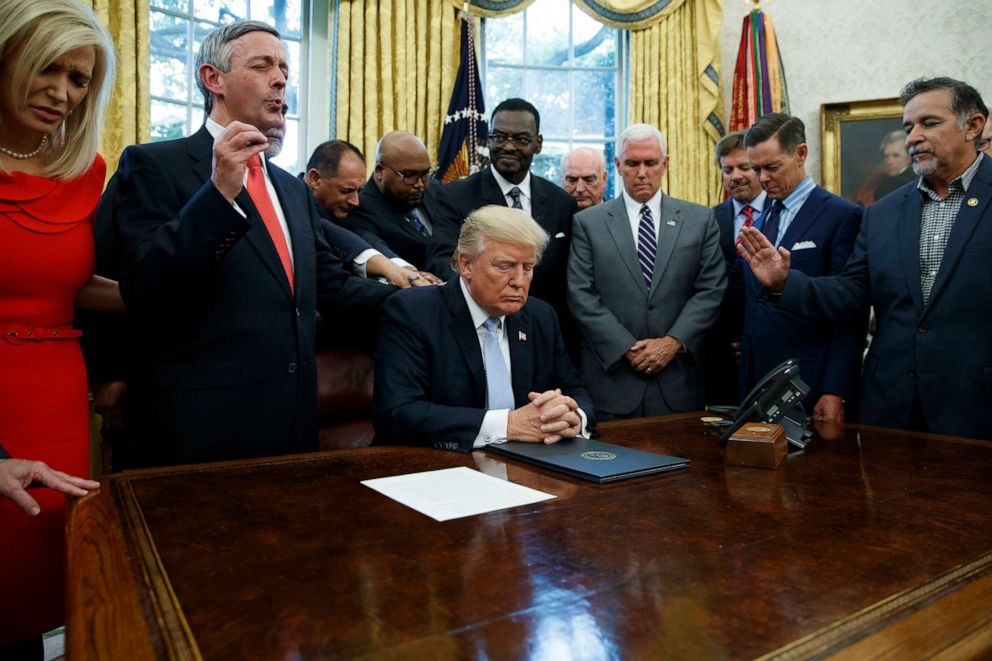 PHOTO: In this Sept. 1, 2017, file photo, religious leaders pray with President Donald Trump after he signed a proclamation for a national day of prayer in the Oval Office of the White House in Washington.
