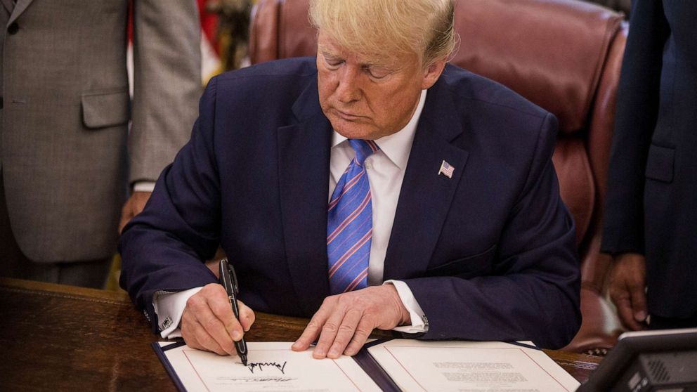 PHOTO: FILE - U.S. President Donald Trump signs H.R. 3151, the Taxpayer First Act, during a ceremony in the Oval Office of the White House in Washington, D.C., July 1, 2019.