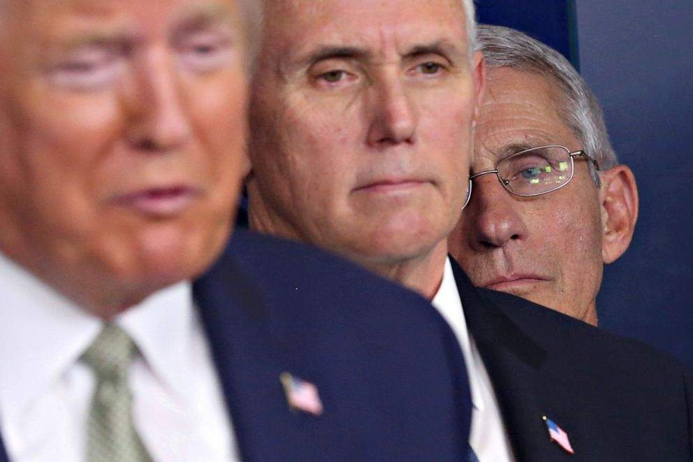 PHOTO: National Institute of Allergy and Infectious Diseases Director Anthony Fauci listens with Vice President Mike Pence as President Donald Trump addresses the daily coronavirus briefing at the White House in Washington on March 17, 2020.