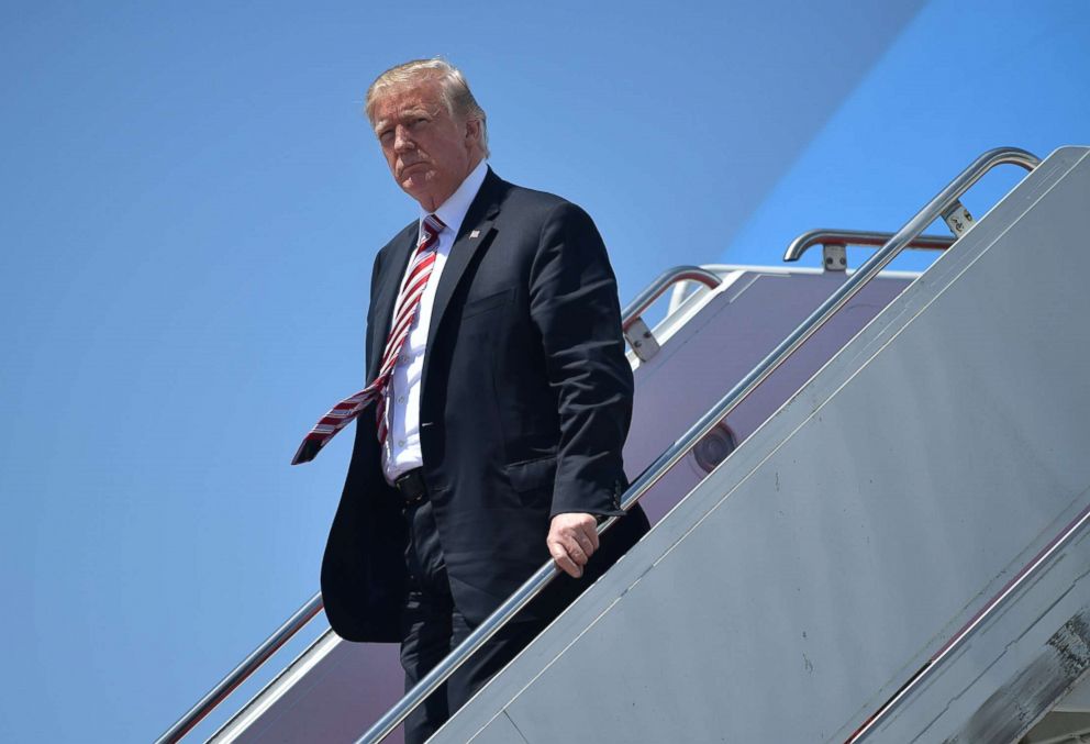 PHOTO: Donald Trump steps off Air Force One upon arrival at Palm Beach International in West Palm Beach, Florida, April 18, 2018. 