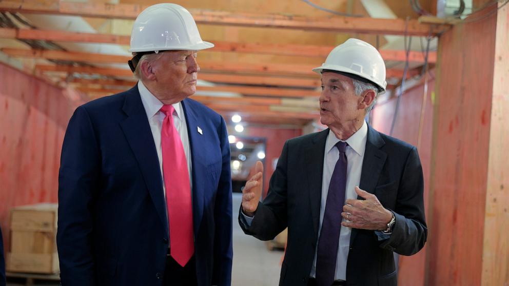 PHOTO: President Donald Trump and Federal Reserve Chair Jerome Powell tour the Federal Reserve's $2.5 billion headquarters renovation project, July 24, 2025 in Washington.