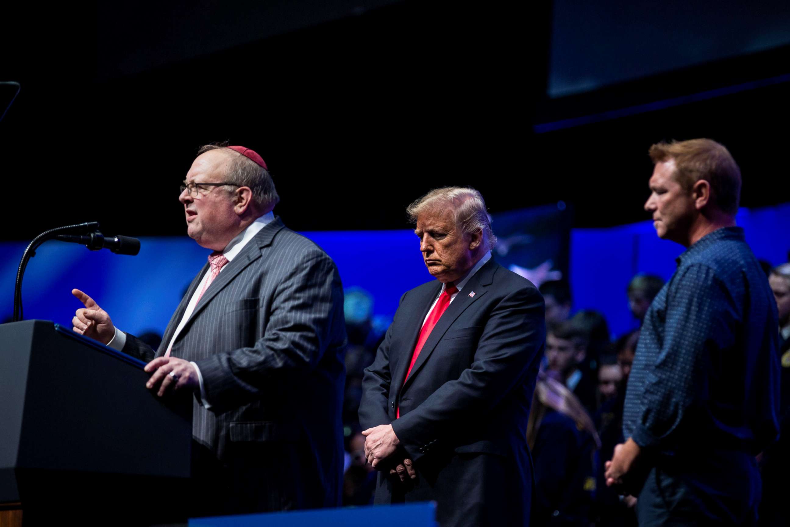 PHOTO: Rabbi Benjamin Sendrow leads a prayer alongside President Donald Trump and Pastor Thom O'Leary, at the 91st Annual Future Farmers of America Convention and Expo, in Indianapolis, Indiana.