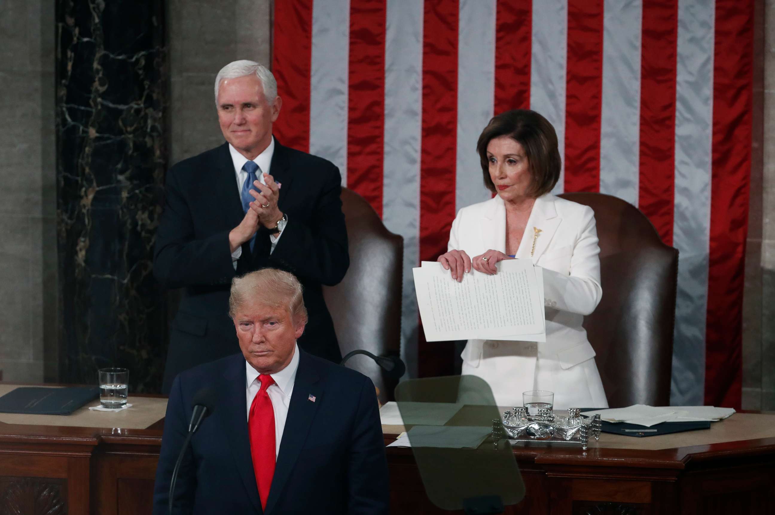 PHOTO: House Speaker Nancy Pelosi, prepares to rip up papers after President Donald Trump delivers a State of the Union address to a joint session of Congress at the Capitol, Feb. 4, 2020. 