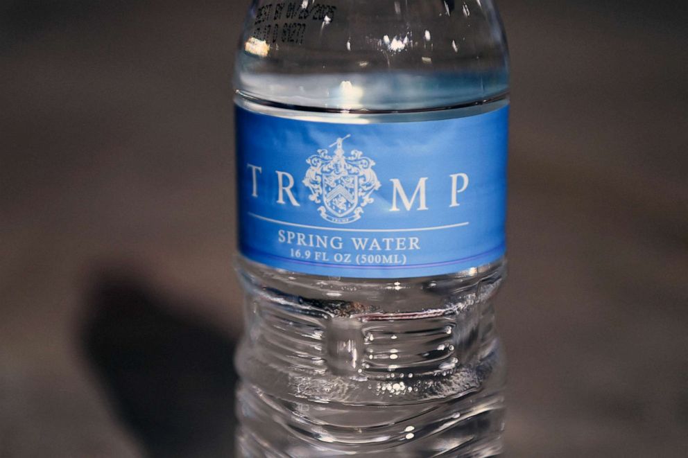 PHOTO: A water bottle with a "Trump" label, part of a bottled water donation by former U.S. President Donald Trump, is seen as he speaks about the recent derailment of a train in East Palestine, Ohio, Feb. 22, 2023.