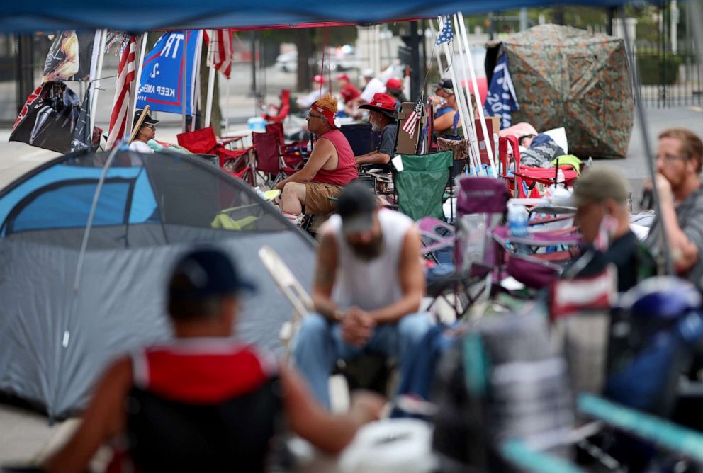 PHOTO: Supporters of President Donald Trump line up to attend the Trump's campaign rally near the BOK Center, site of tomorrow's rally, June 19, 2020 in Tulsa, Okla.