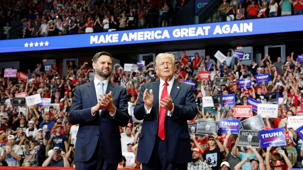 PHOTO: Former President Donald Trump and Republican vice-presidential candidate Sen. J.D. Vance arrive at a campaign rally, July 20, 2024, in Grand Rapids, Mich.