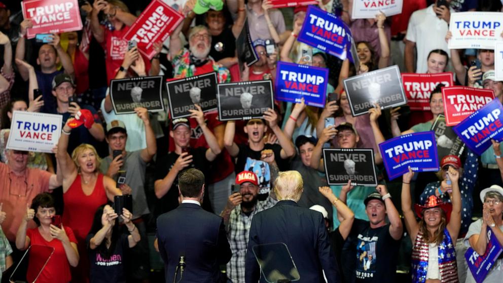 PHOTO: The crowd cheers as former President Donald Trump with vice presidential nominee J.D. Vance attend their first campaign rally together at Van Andel Arena in Grand Rapids, Mich., July 20, 2024.
