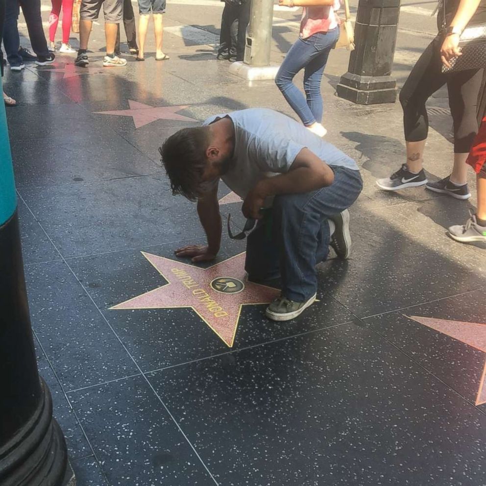 Dozens of vinyl stars for Donald Trump were placed on the Hollywood Walk of Fame on Friday, Aug. 10, 2018. 