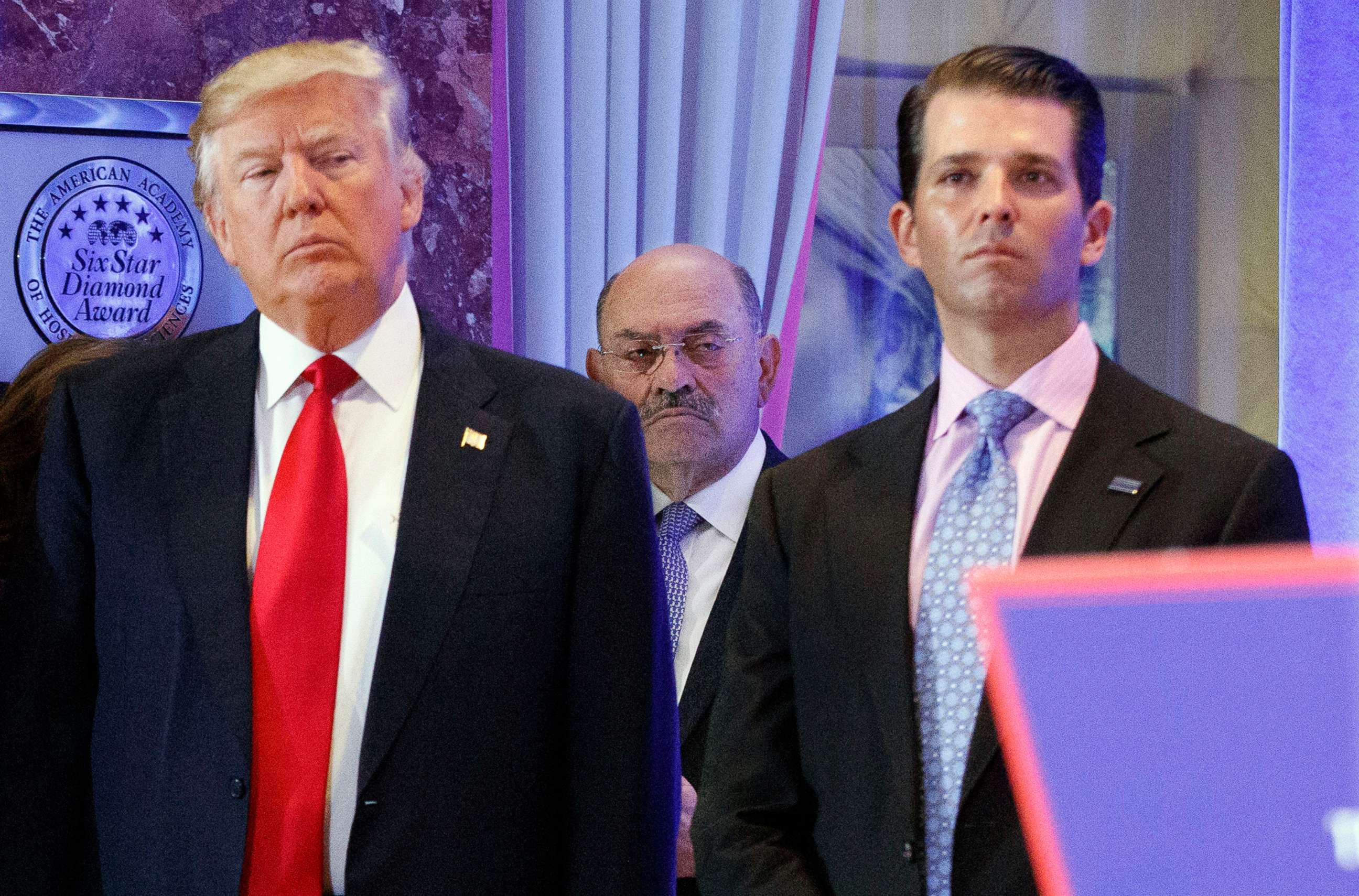 PHOTO: In this Jan. 11, 2017, file photo, Allen Weisselberg, center, stands between President-elect Donald Trump, left, and Donald Trump Jr., at a news conference in the lobby of Trump Tower in New York.